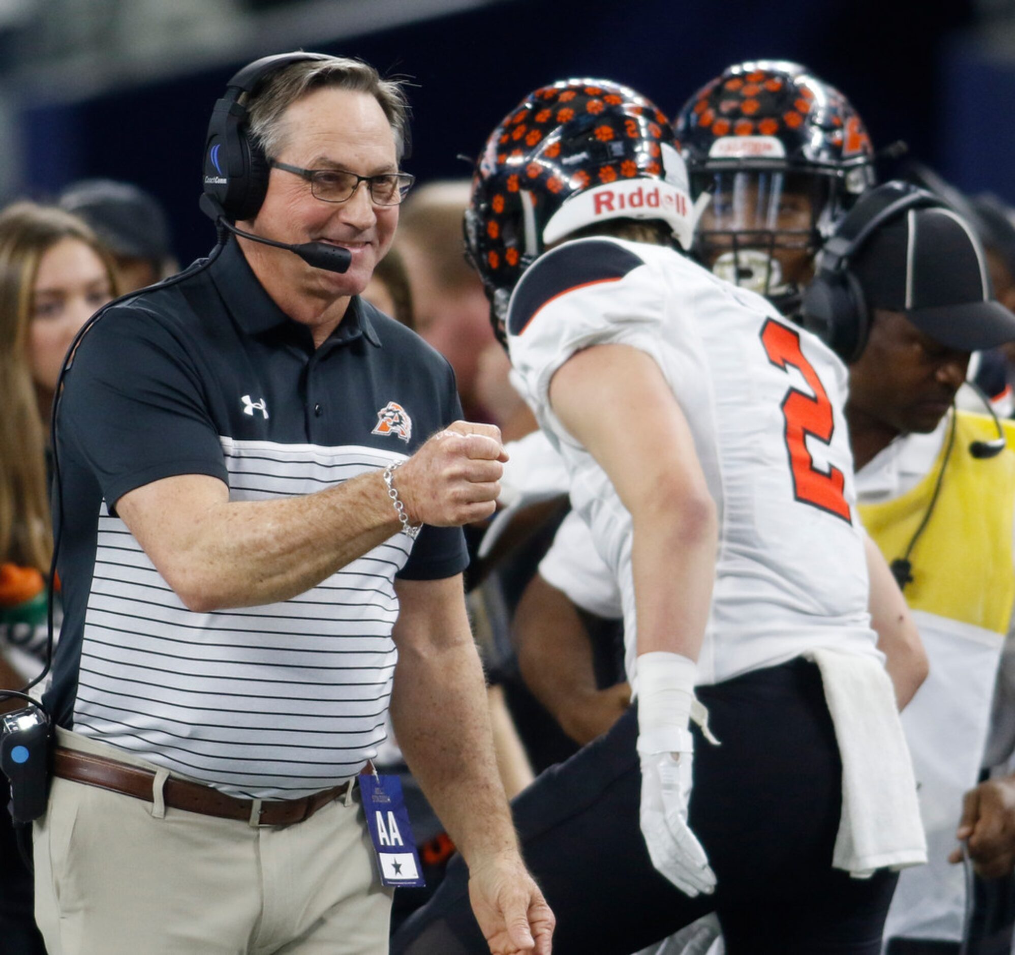 Aledo head coach Tim Buchanan was all smiles as he greets Bearcat Jaedon Pellegrino (2)...