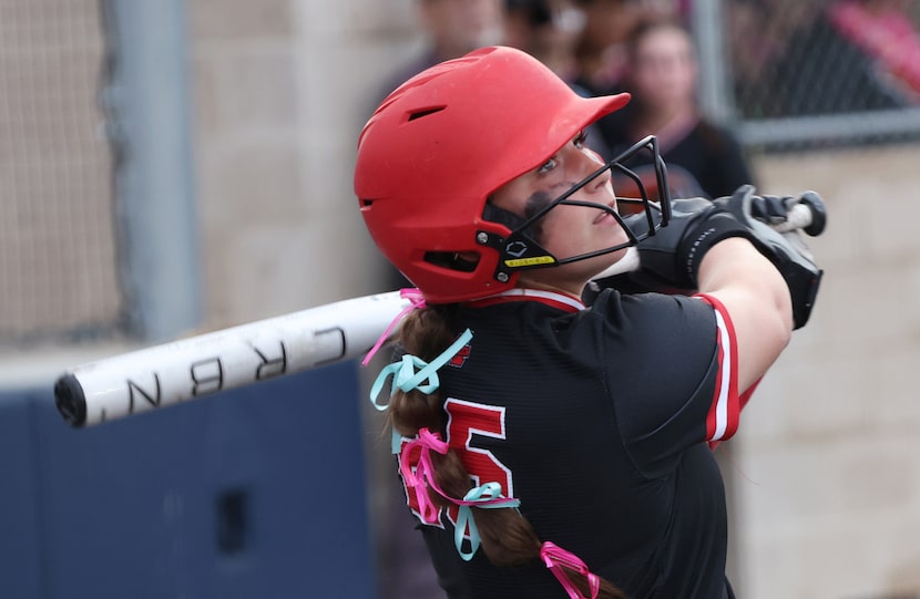 Melissa catcher Hutton "Lulu" Adrian (25) watches a long line drive sent foul while batting...