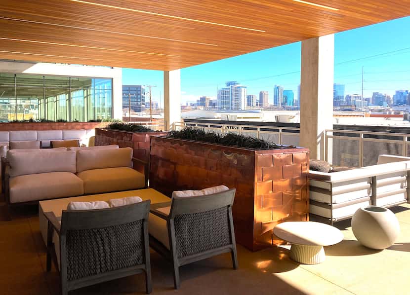 The River Edge building has multiple outside seating areas on balconies and decks.