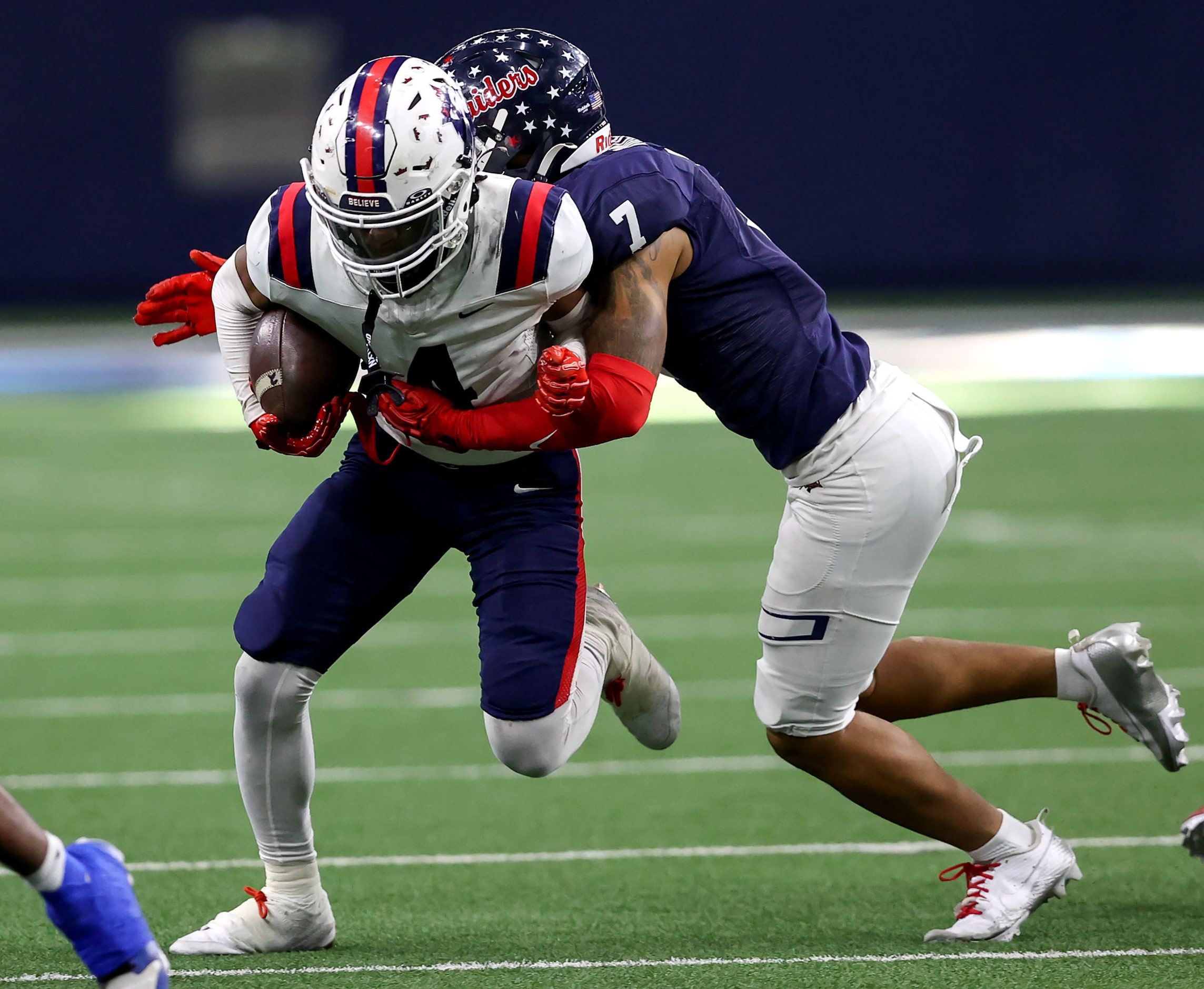 Richland wide receiver Deon Jones (4) is stopped by Denton Ryan defensive back Jaxson Dozier...