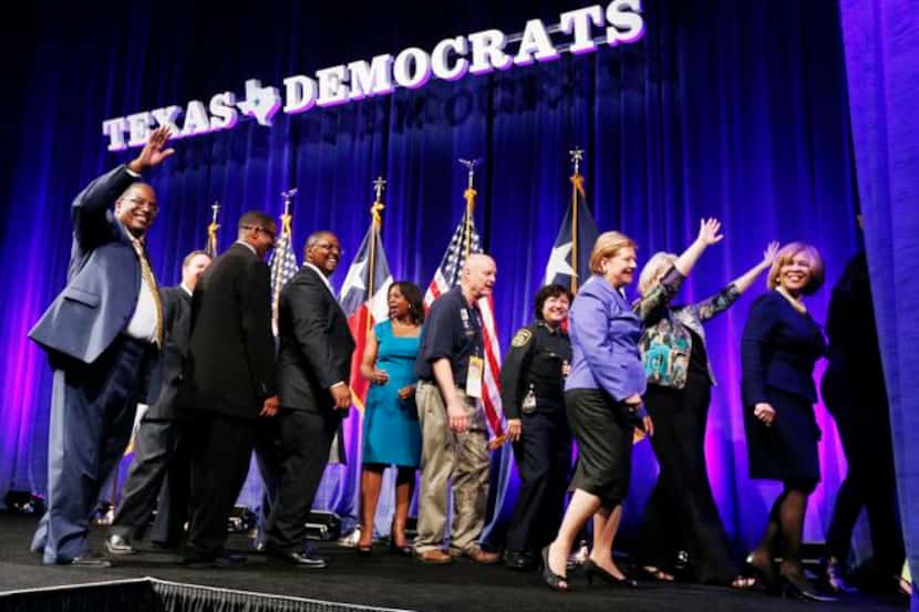 Democratic officials from Dallas, including state Sen. Royce West (left), filled the stage...