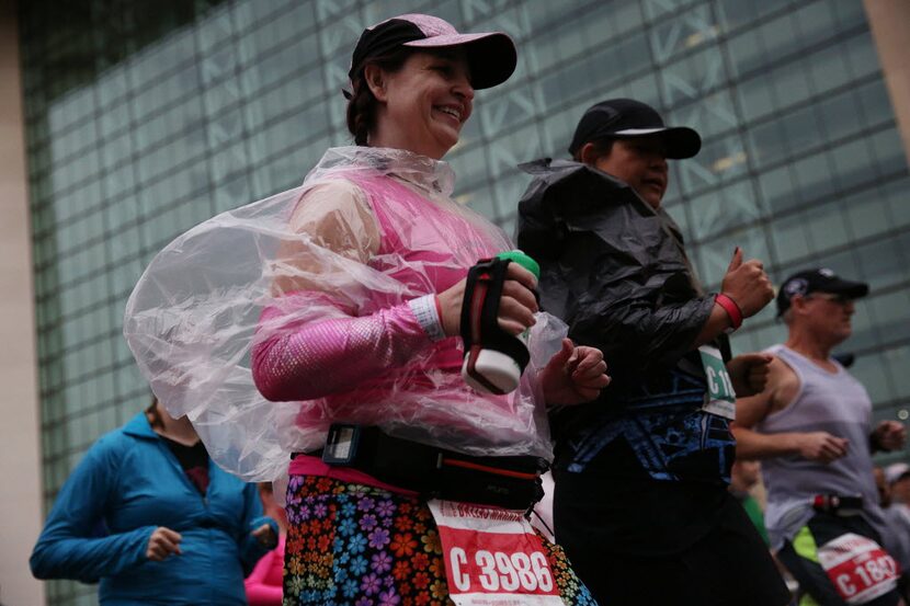 Ellen Cardona, shows how you can smile even while running in the rain. 