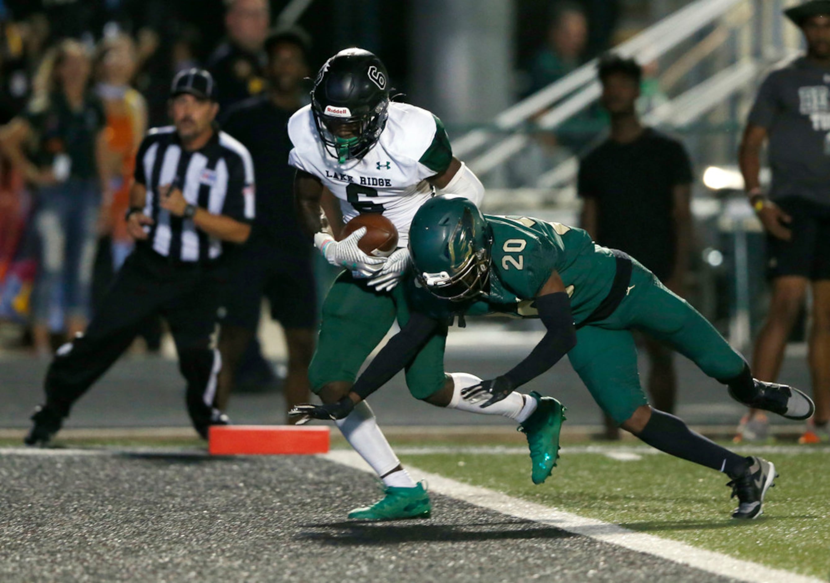 Mansfield Lake Ridge's Cotis Martin (6) scores a touchdown in front of DeSoto's Lathan Adams...