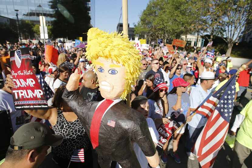  Protesters hoisted a Donald Trump piÃ±ata during a march last September to American...