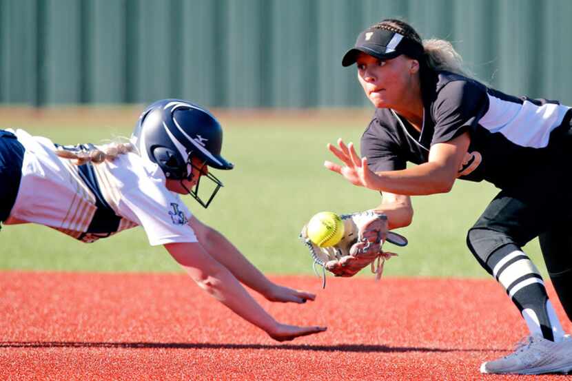 Little Elm center fielder Tatum Mowery (3) was ruled safe at second base as The Colony...