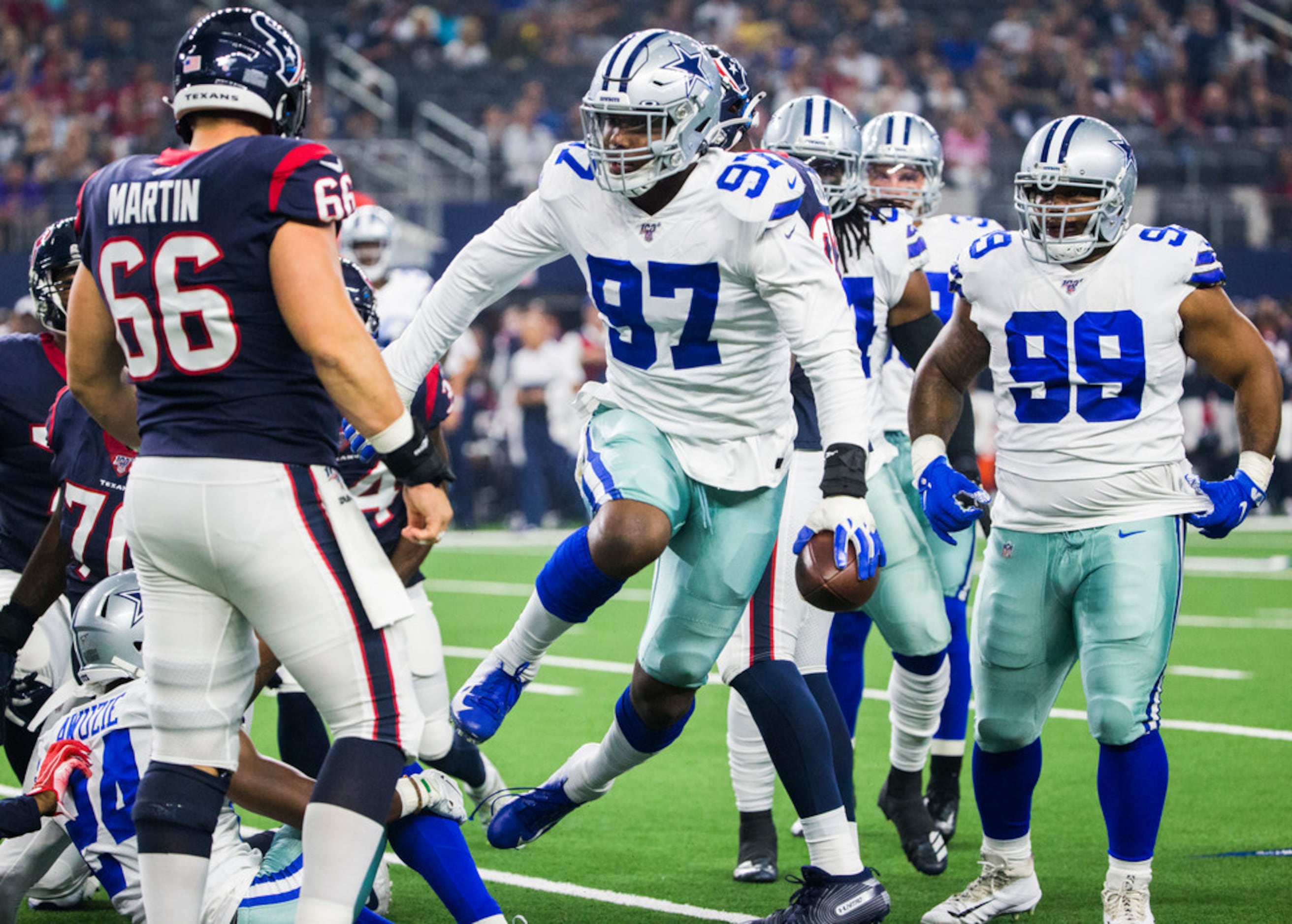 August 24th, 2019:.Dallas Cowboys defensive end Taco Charlton (97) recovers  a fumble during an NFL football game between the Houston Texans and Dallas  Cowboys at AT&T Stadium in Arlington, Texas. Manny Flores/CSM