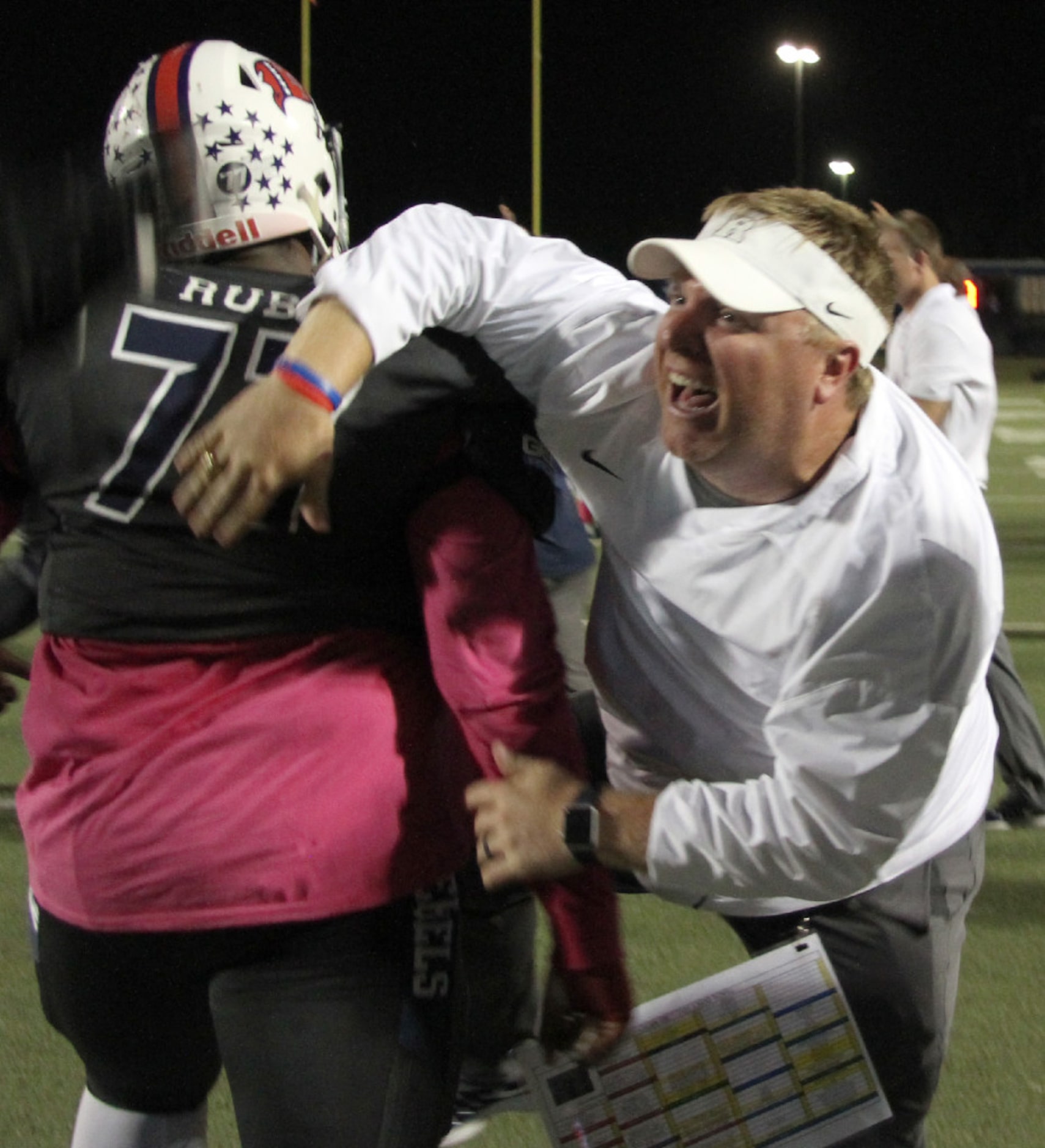 Richland offensive coordinator Daniel Oelschlegel shares his excitement with Rebel Jaiden...