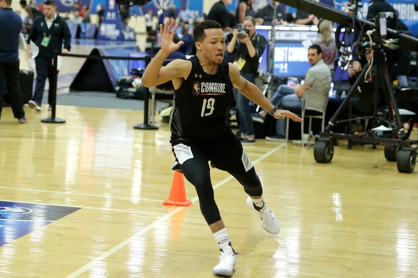 Jalen Brunson, from Villanova, participates in the NBA draft basketball combine Thursday,...