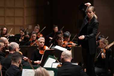 Conductor Karina Canellakis and violinist Randall Goosby (not pictured) perform with the...