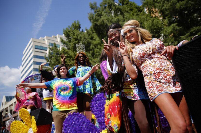 A group of people on the Caven Enterprises float pose for a photo during the Alan Ross Texas...