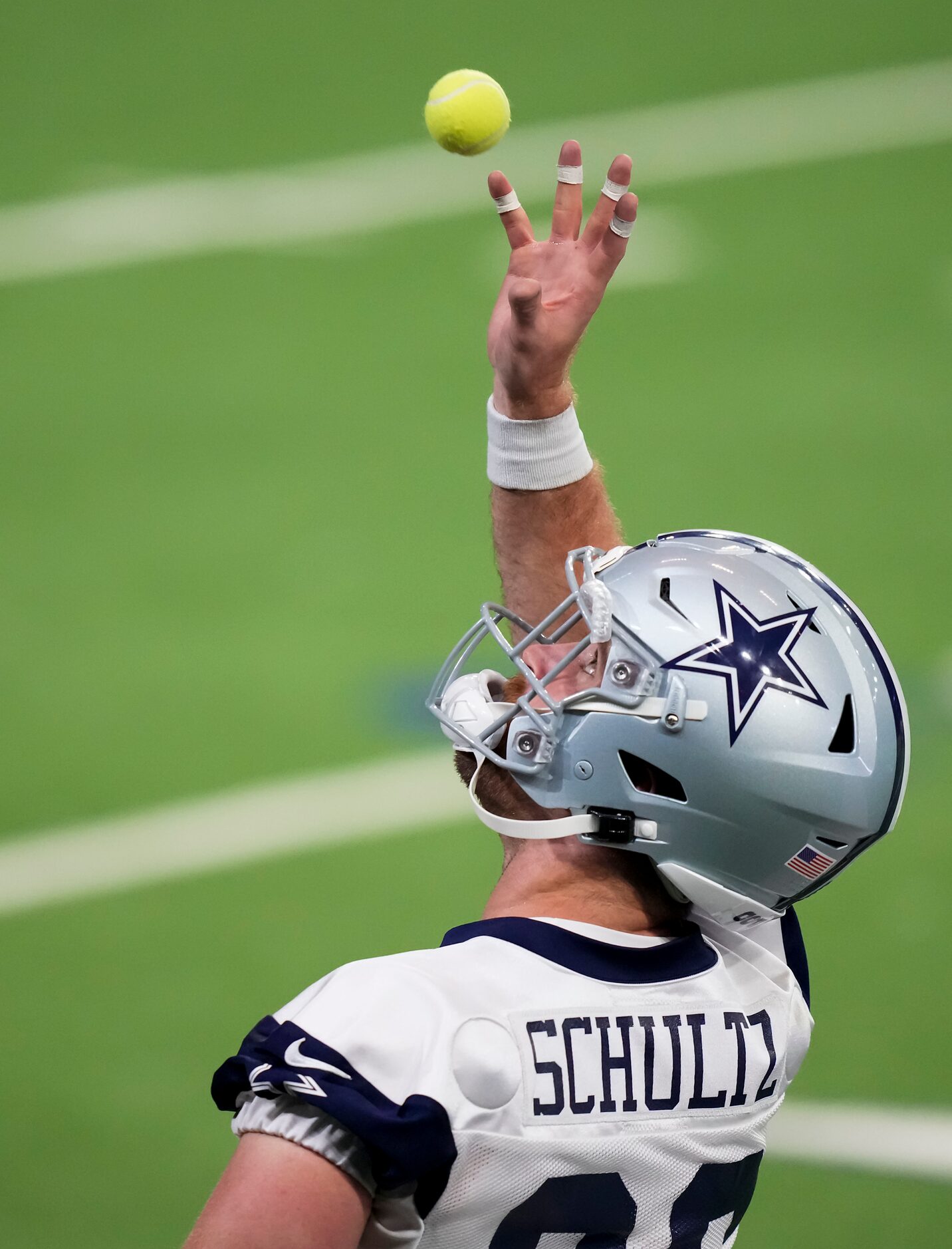 Dallas Cowboys tight end Dalton Schultz catches a tennis ball during the OTA team's practice...