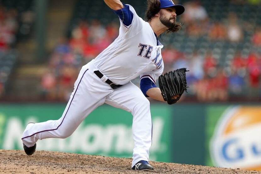 Texas Rangers relief pitcher Tony Barnette (43) throws in the eighth inning against the...