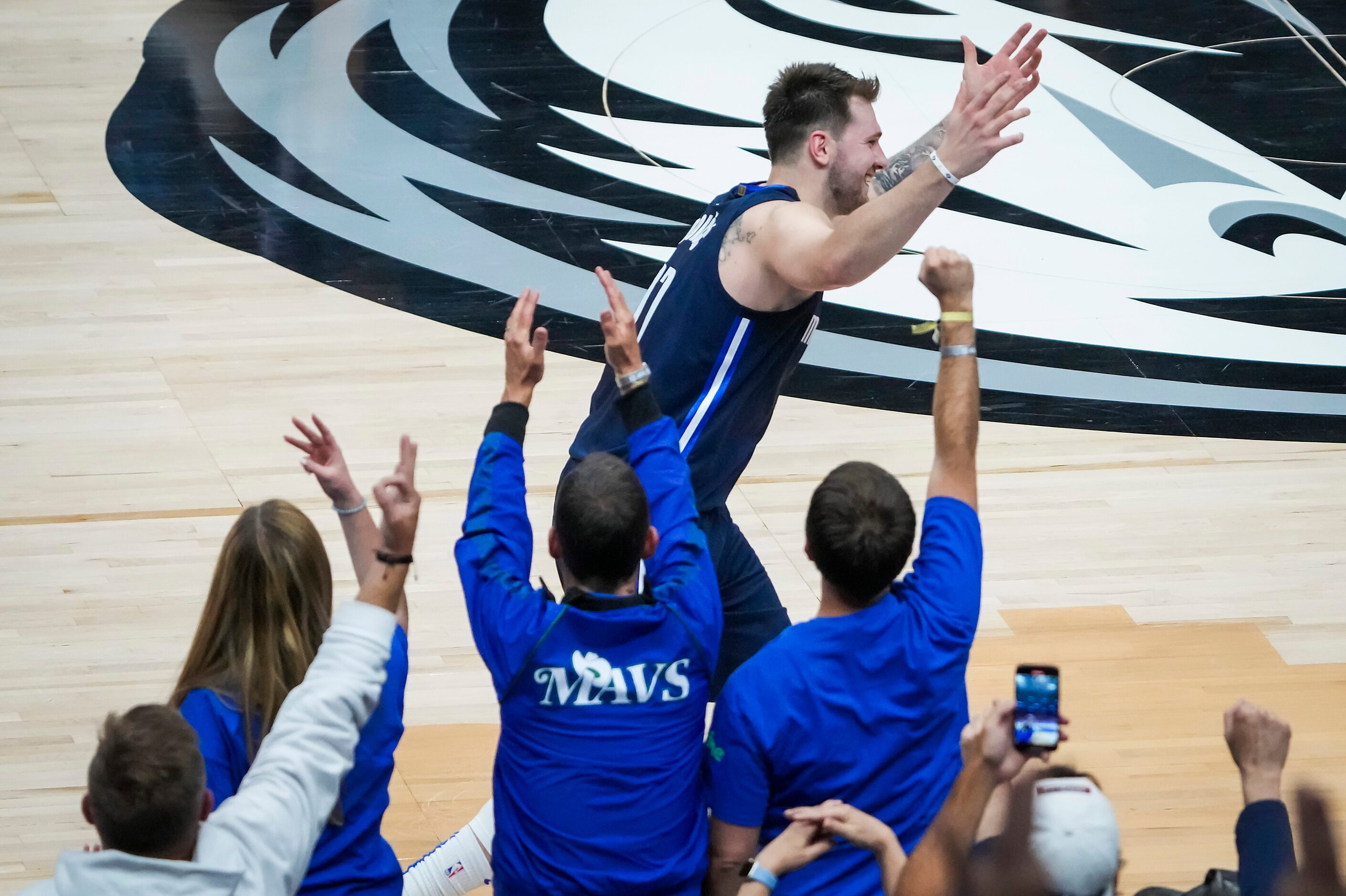 Dallas Mavericks guard Luka Doncic (77) celebrates after hitting a 3-pointer during the...