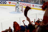 Dallas Stars goaltender Jake Oettinger (29) looks up as fans celebrate after Edmonton Oilers...