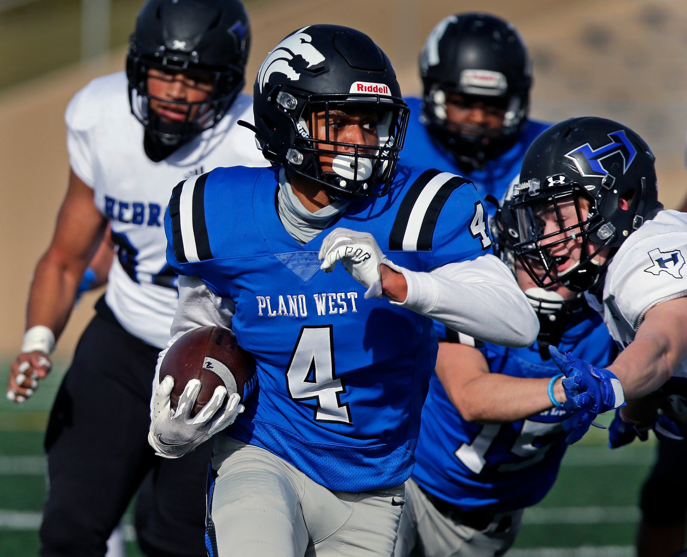 Plano West High School wide receiver Tyler Harrell (4) runs after the catch during the first...