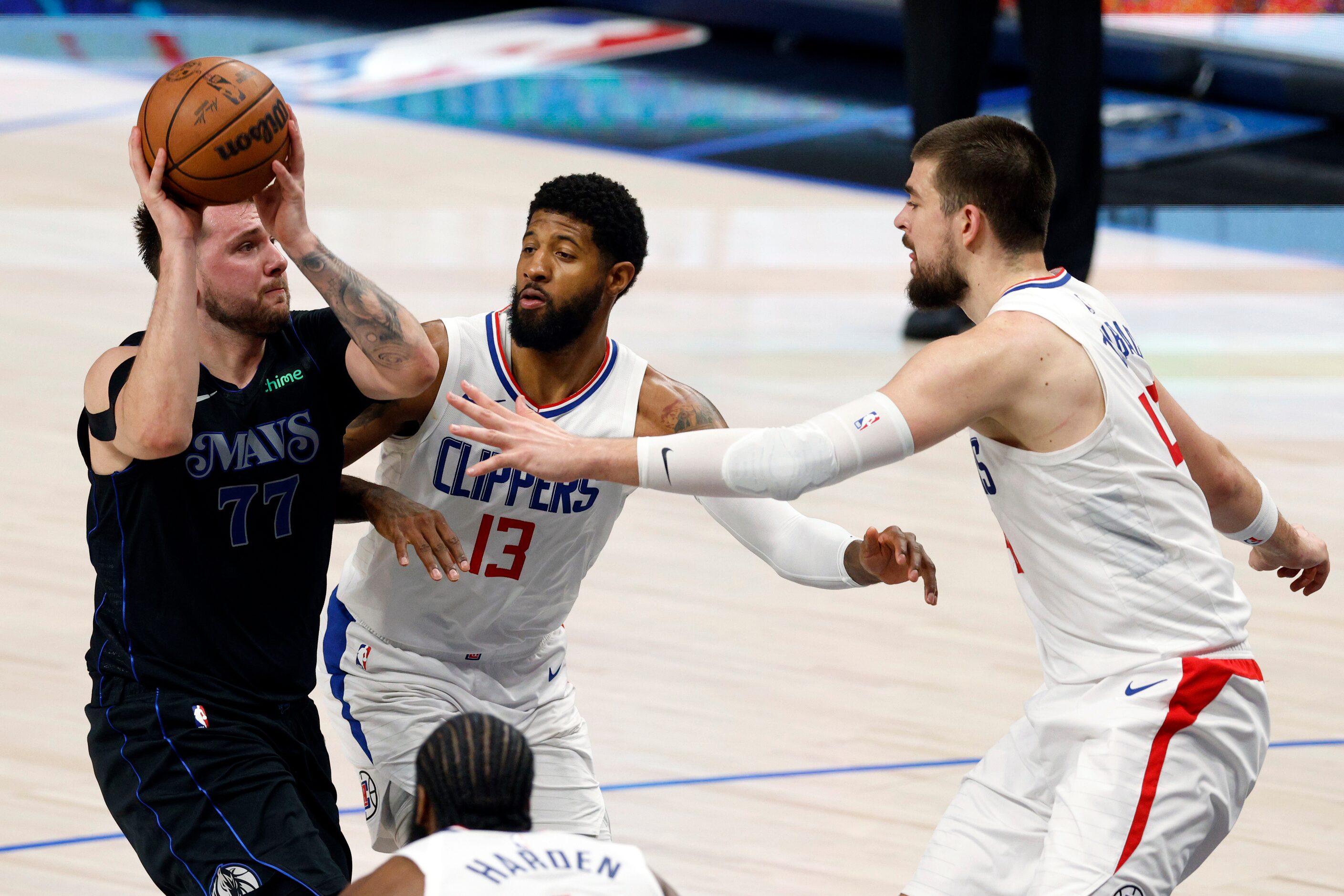 Dallas Mavericks guard Luka Doncic (77) drives the paint against LA Clippers forward Paul...