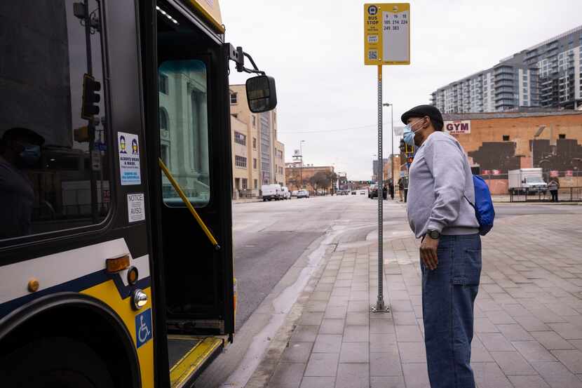 Kenneth Mosley asks a bus driver for help as he looks for DART route 16 on Monday. DART's...