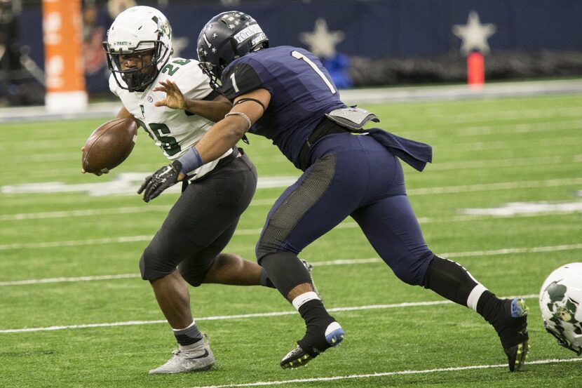 Poteet's Walter Dawn Jr. (26) attempts to evade a defender during the 5A Division 1 Region 2...