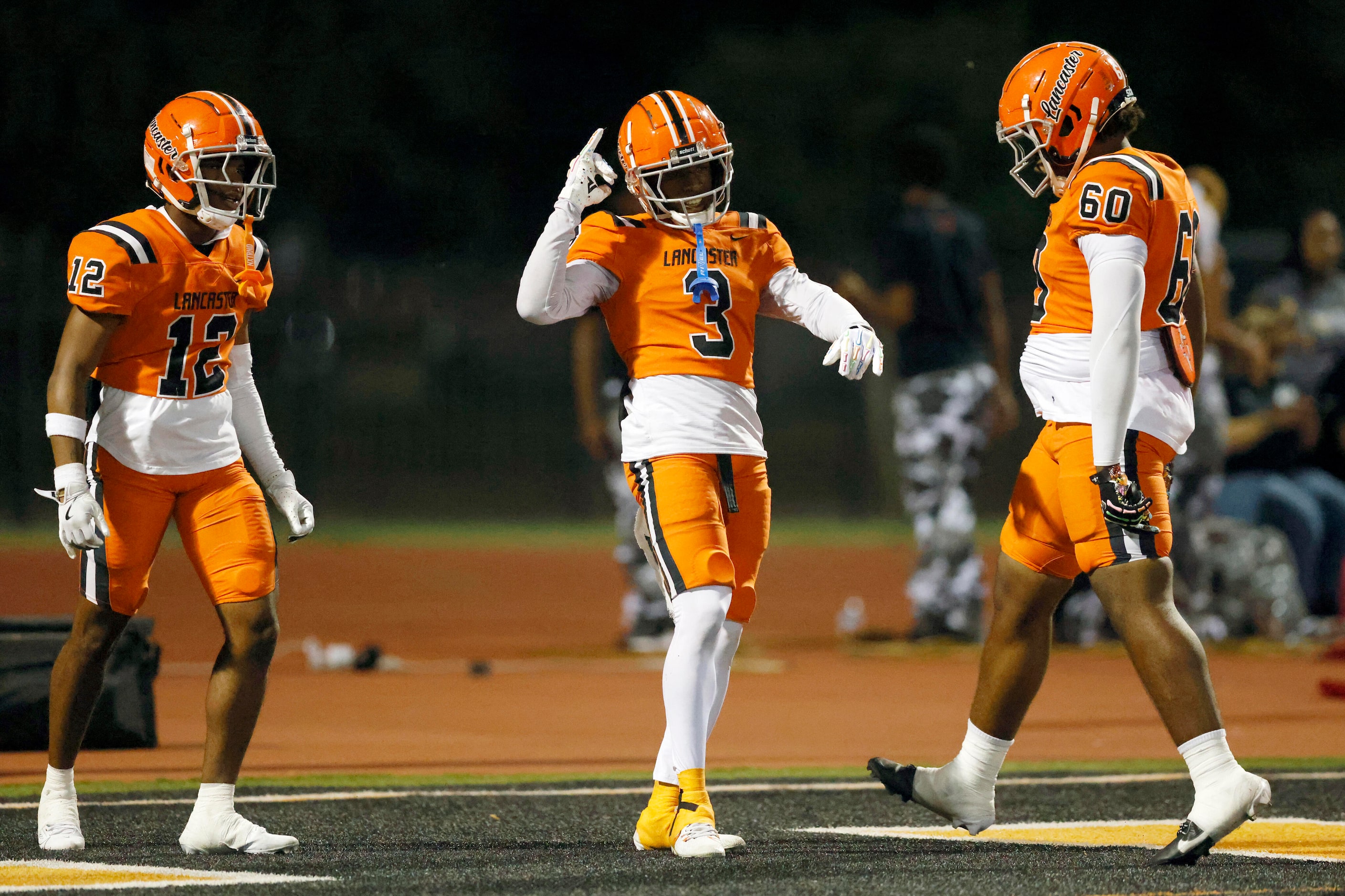 Lancaster wide receiver Ja’Quavius Pipkin (3) celebrates his touchdown reception with wide...