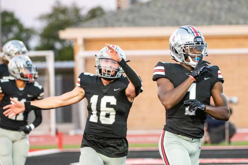 Lovejoy wide receiver Kyle Parker (1) and quarterback Brayden Hagle (16) celebrate after...