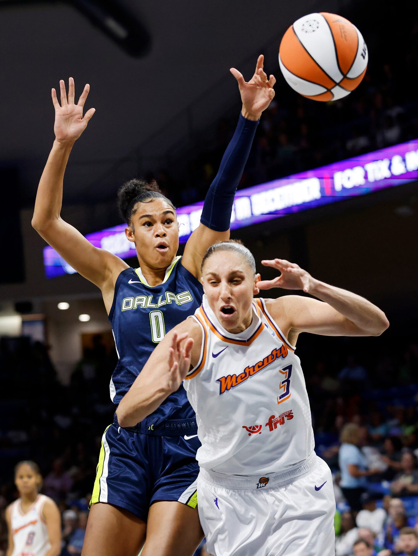 Phoenix Mercury guard Diana Taurasi (3) is fouled by Dallas Wings forward Satou Sabally (0)...