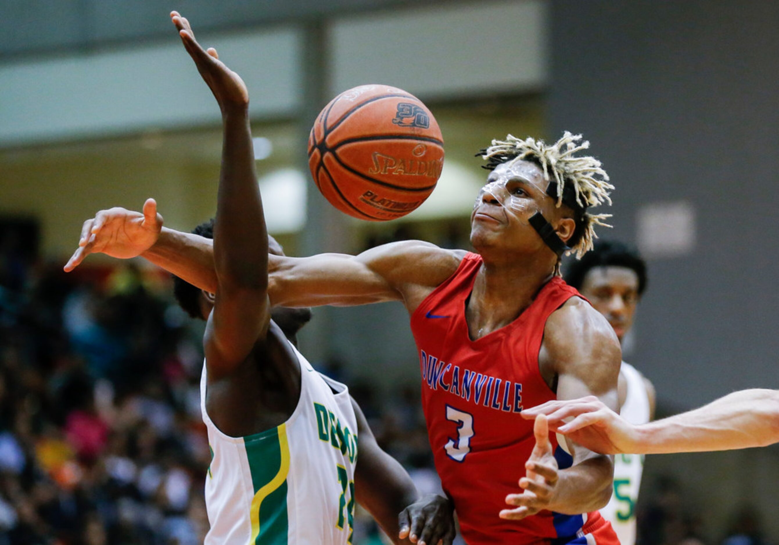 Duncanville senior guard Jahmi'us Ramsey (3) loses control of the ball as DeSoto senior...