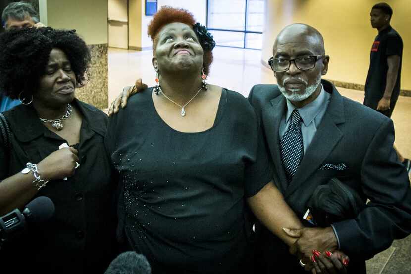Vickie Cook (center), the victim's mother, leaves the courtroom after the jury returned a...