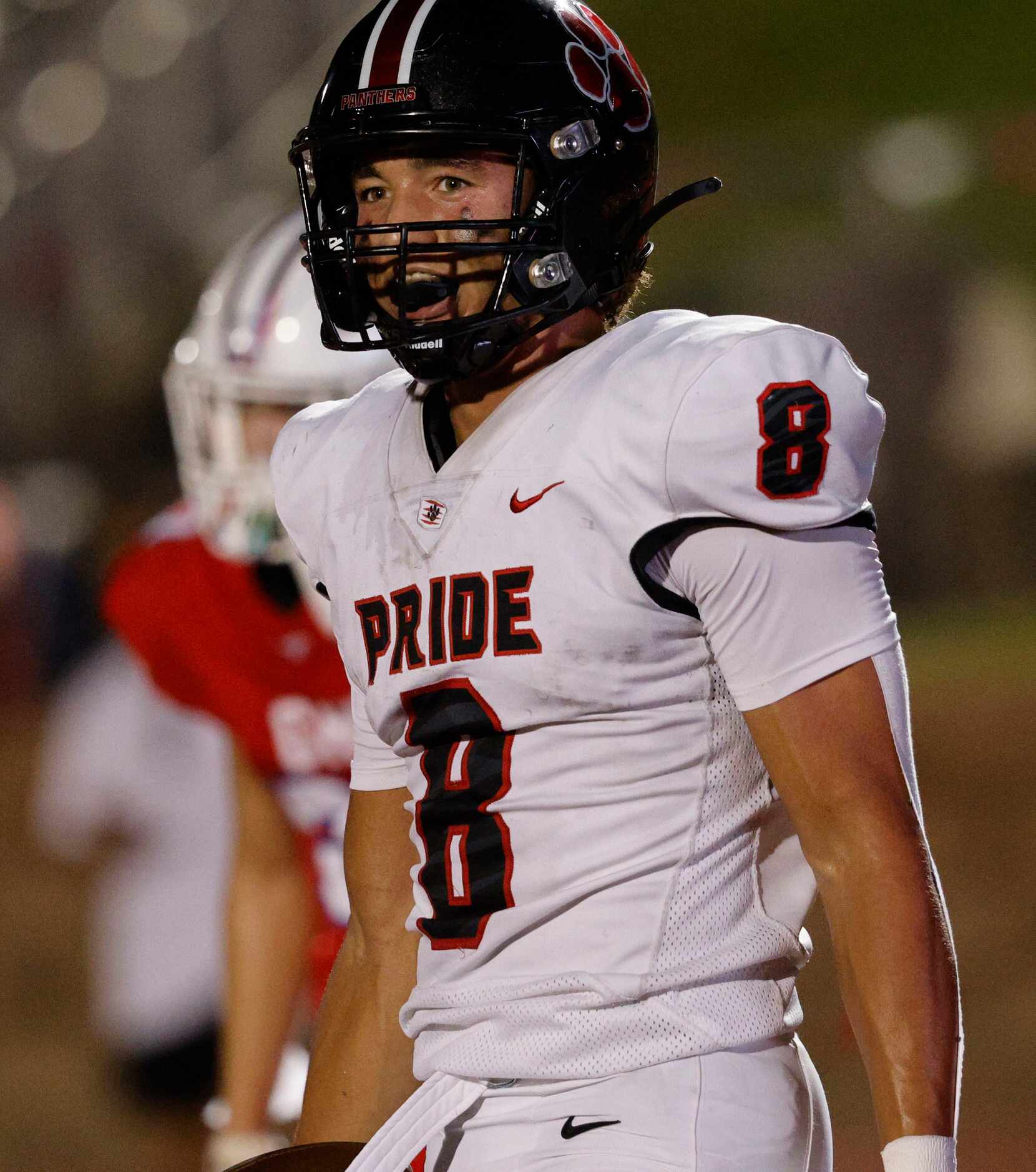 Colleyville Heritage's Braden Blueitt (8) smiles after he scored a touchdown during the...