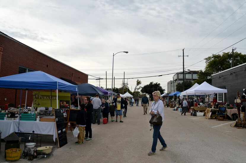 
People browse among tents during a recent Urban Flea event in Garland. The city wants the...