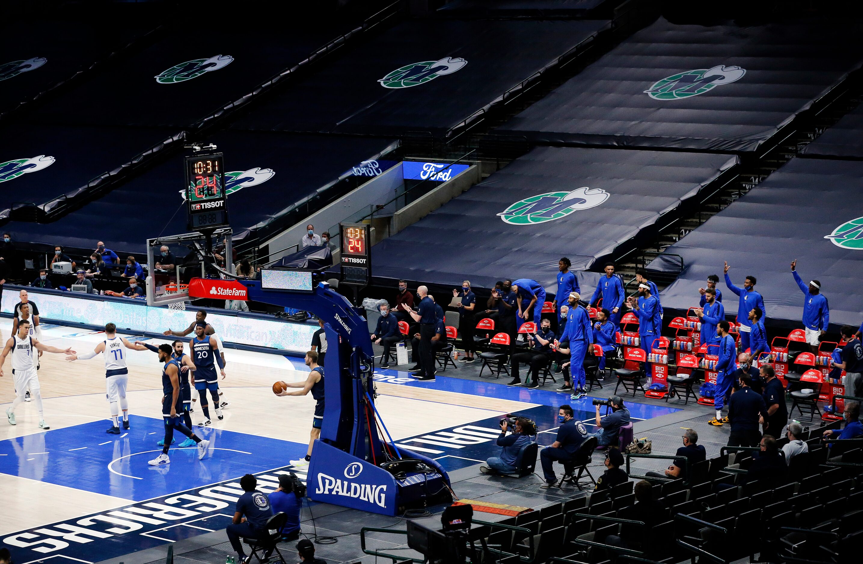 Before the empty stands of the American Airlines Center, Dallas Mavericks guard Luka Doncic...