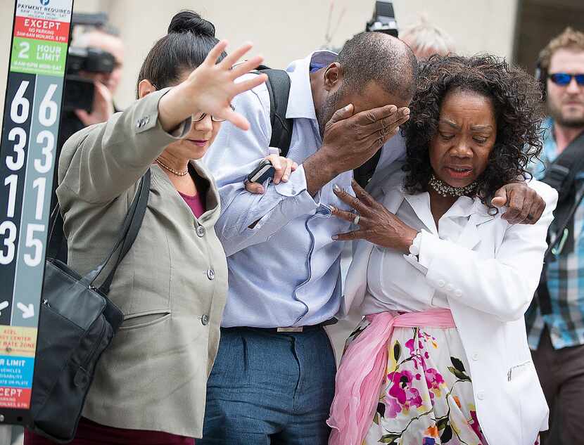 Family and friends of Valerie Castile and Philando Castile walked out of the courthouse...
