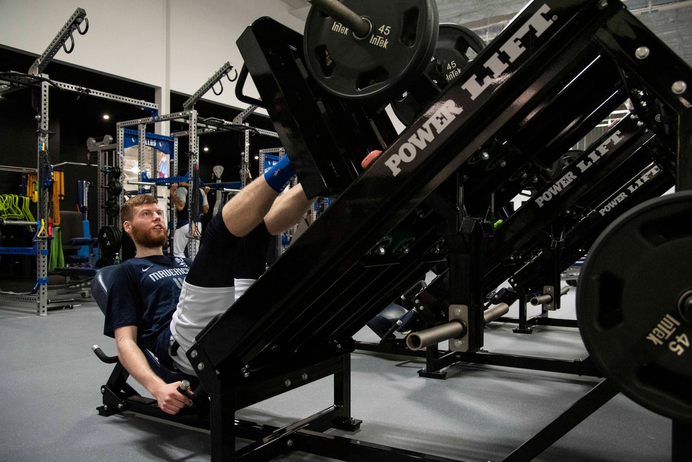 Dallas Mavericks shooting forward Davis Bertans (44) uses the leg press in the weight room...