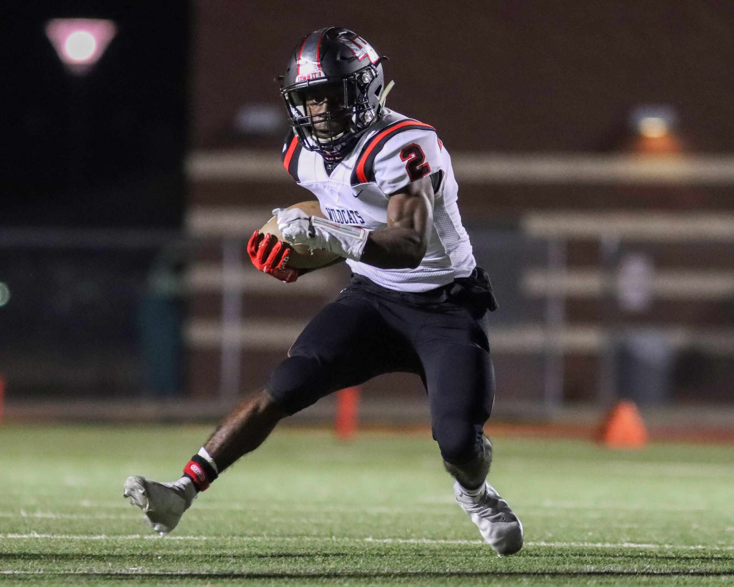 Lake Highlands running back Noelle Whitehead (2) runs the ball during the first half against...