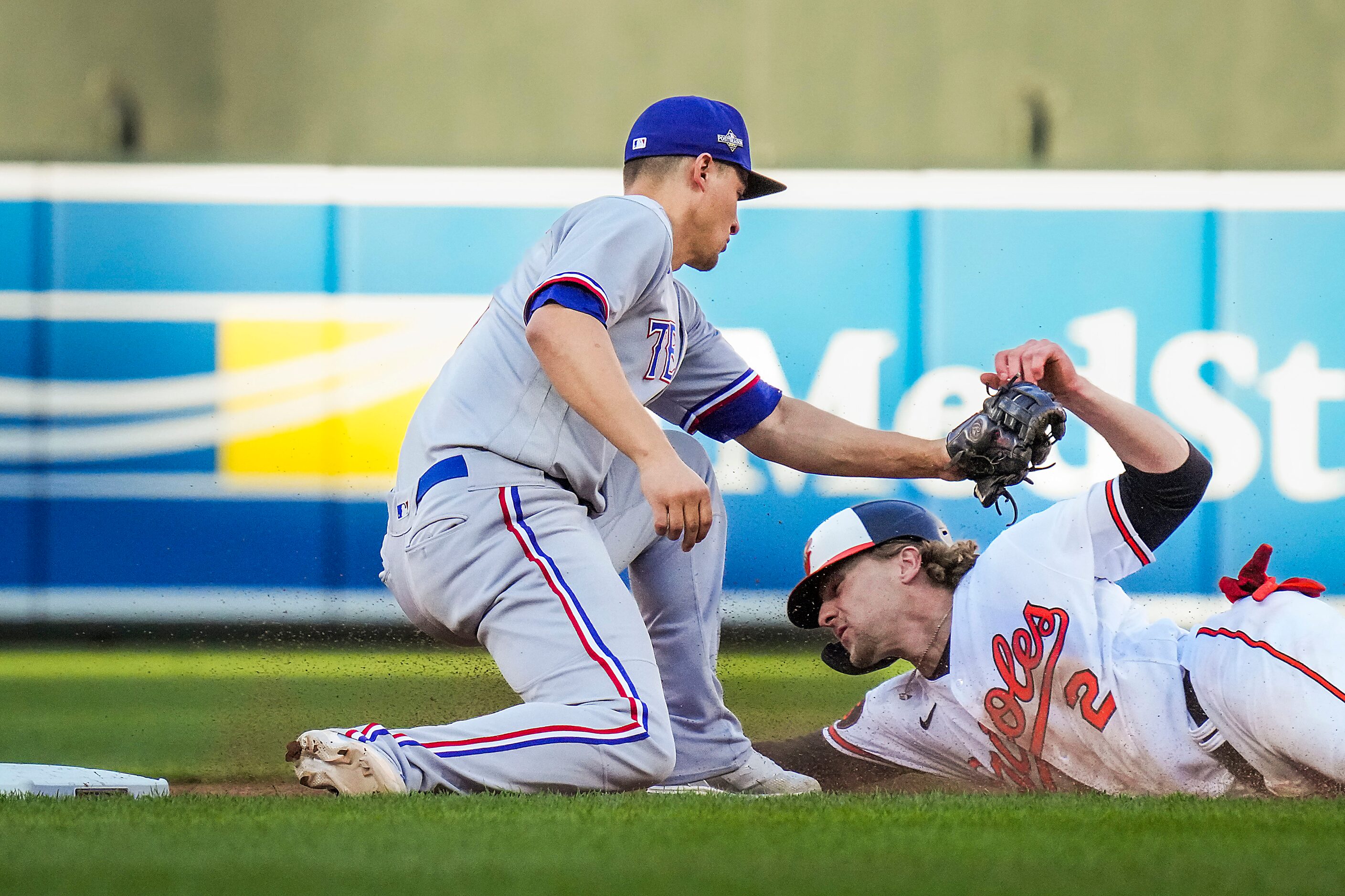 Baltimore Orioles third baseman Gunnar Henderson (2) is caught stealing as Texas Rangers...