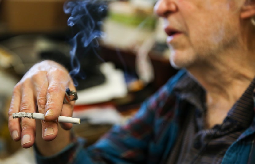 Bill Wisener smokes a cigarette Friday, Nov. 30, 2018 at his store, Bill's Records, in Dallas. 