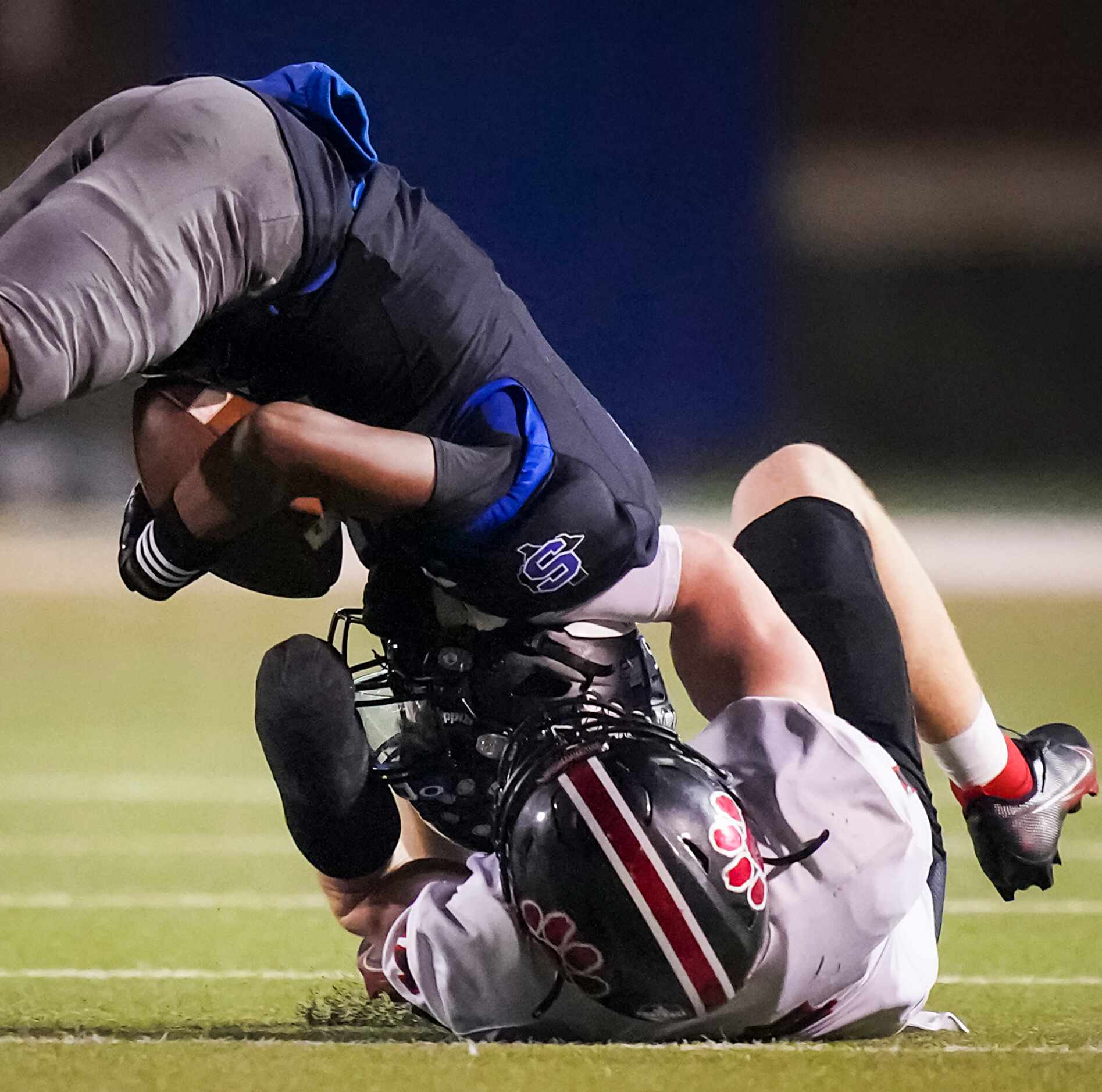 Mansfield Summit wide receiver Bryan Spotwood Jr. (5) is brought down by Colleyville...