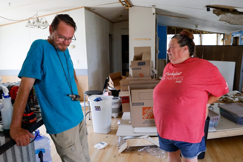 David Vickery talks with wife Deanna Vickery inside their home, which was destroyed by an...