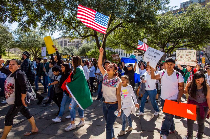 Protesters march in the streets outside the Texas State Capital on 'A Day Without...