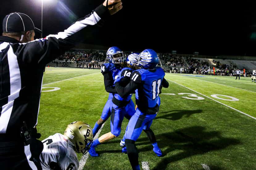 North Forney defensive back Jacob Donaldson (14) celebrate with his tam after intercepting a...