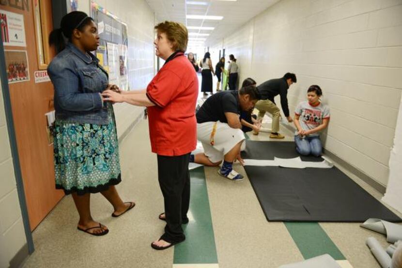 
Teacher Suzanne Reese talks to Student Council president Sydney Franklin during her...
