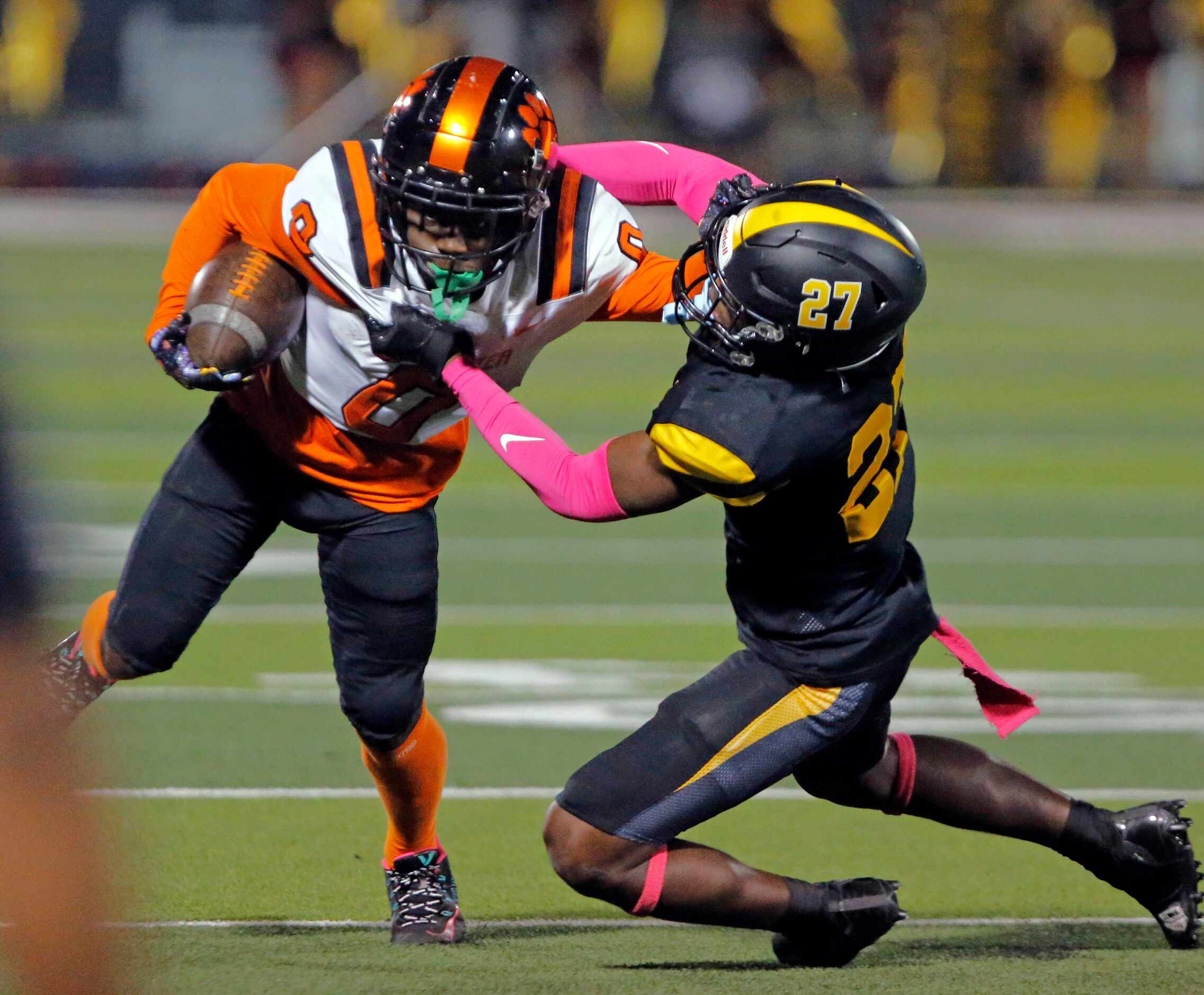 Lancaster high’s Ti’Erick Martin (0) is tackled by Forney high’s Josiah Turner (27) during...