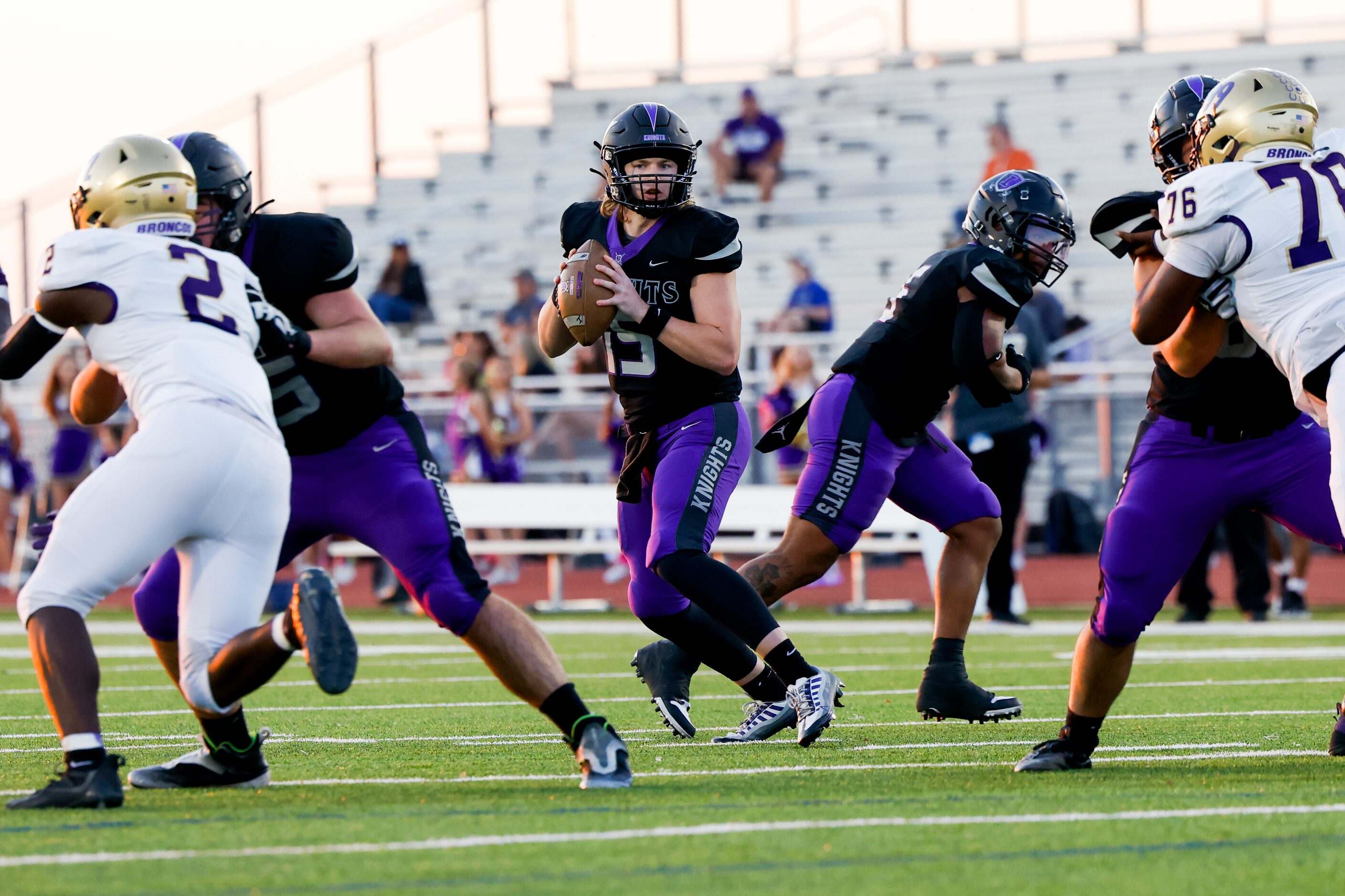 Frisco Independence’s quarterback Matteo Quattrin (15) looks through an opening as Denton...