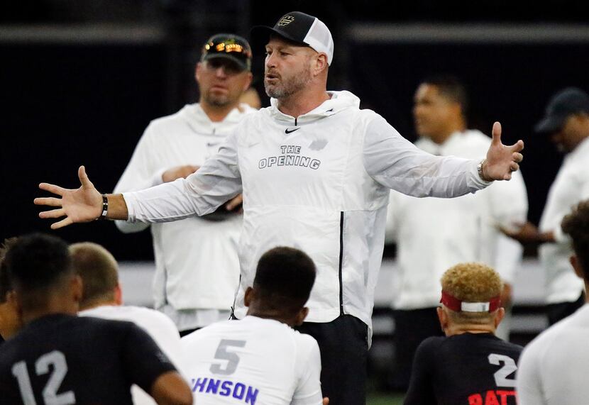 Former NFL quarterback Trent Dilfer speaks to youths at The Opening, an elite football camp...