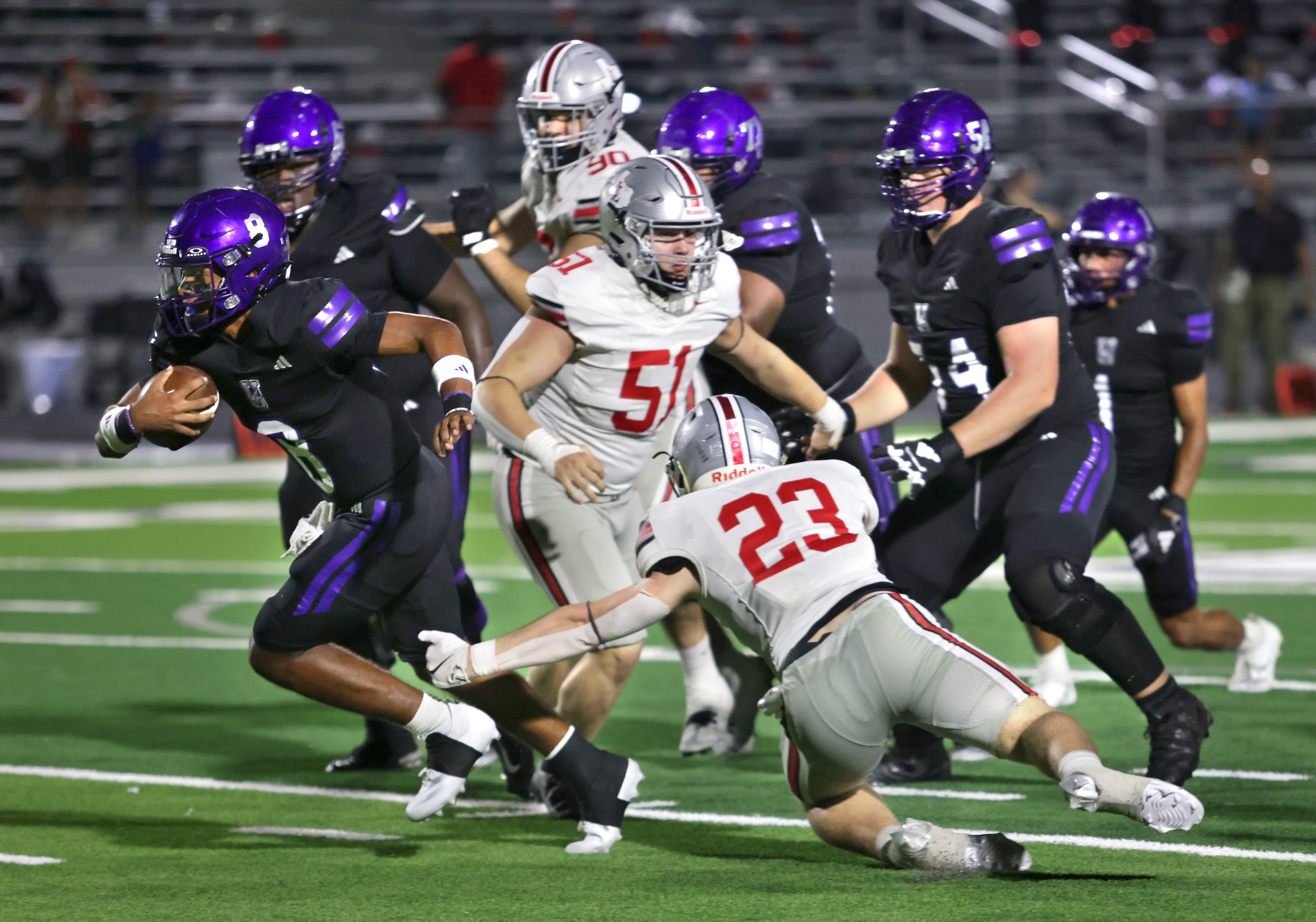 Anna player #8 Ziondre Williams breaks free from the pack during the Lovejoy High School at...