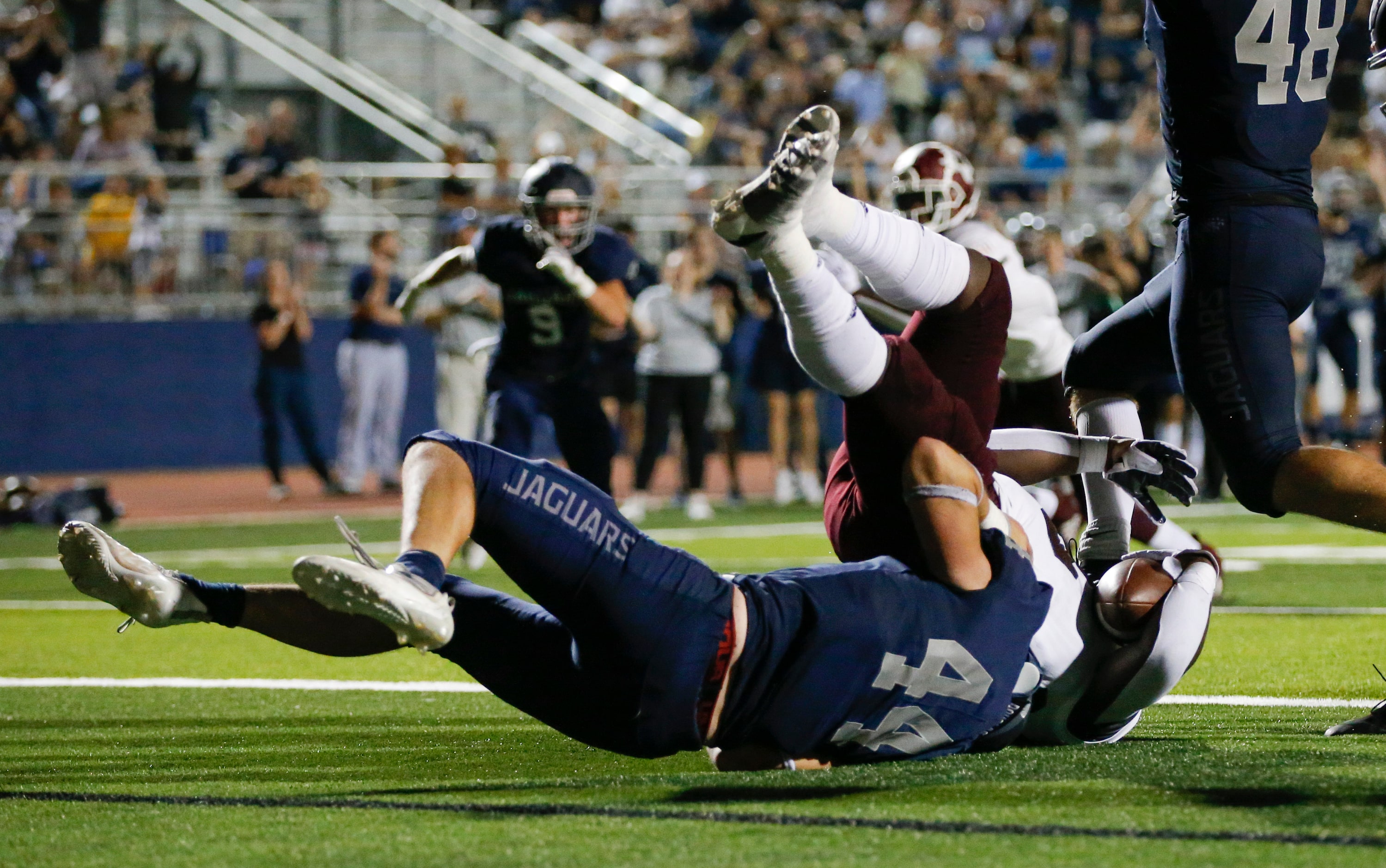 Flower Mound senior linebacker Ryan Brubaker (44) tackles Mesquite senior running back KD...