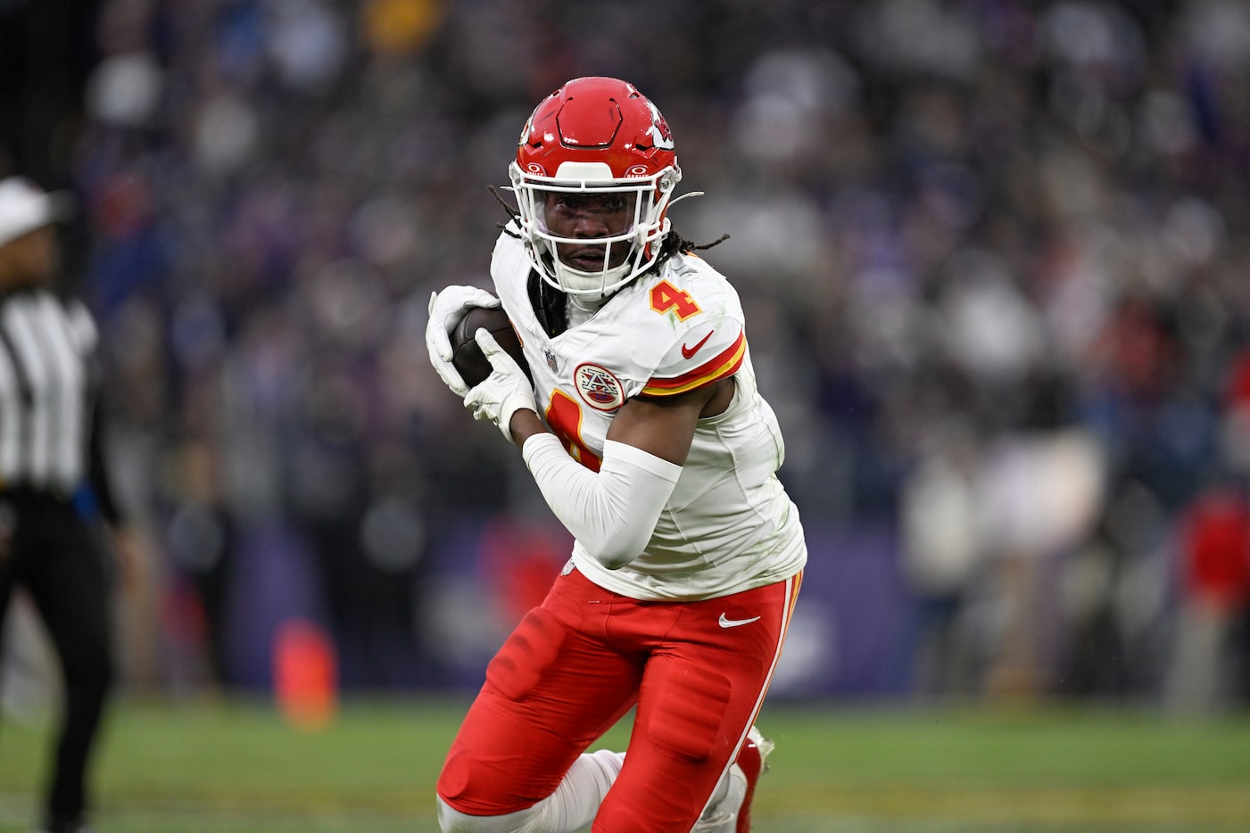 Kansas City Chiefs wide receiver Rashee Rice (4) runs with the ball after catching a pass...