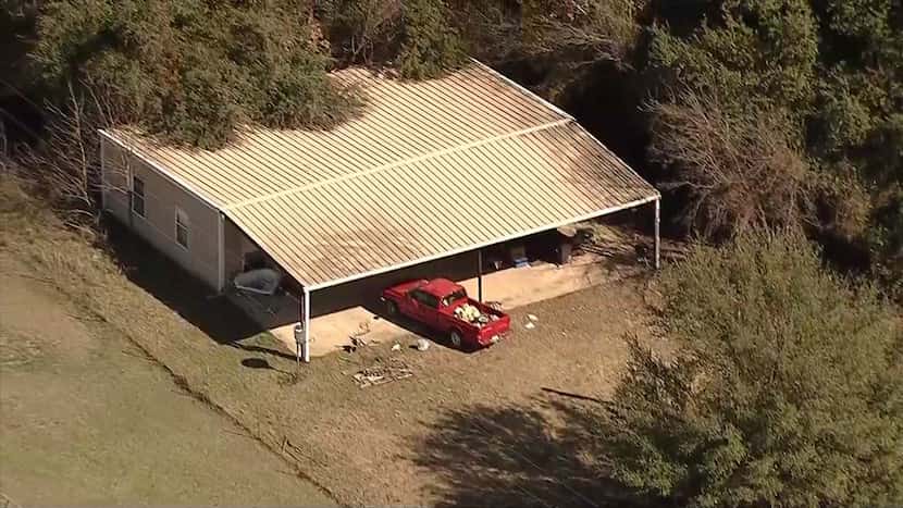 An aerial photo shows the home where officials say Wise County sheriff's deputies found four...