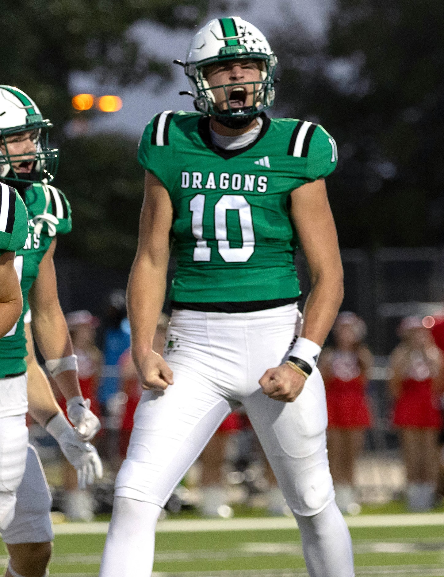 Southlake Carroll quarterback Graham Knowles celebrates a touchdown run against Flower Mound...