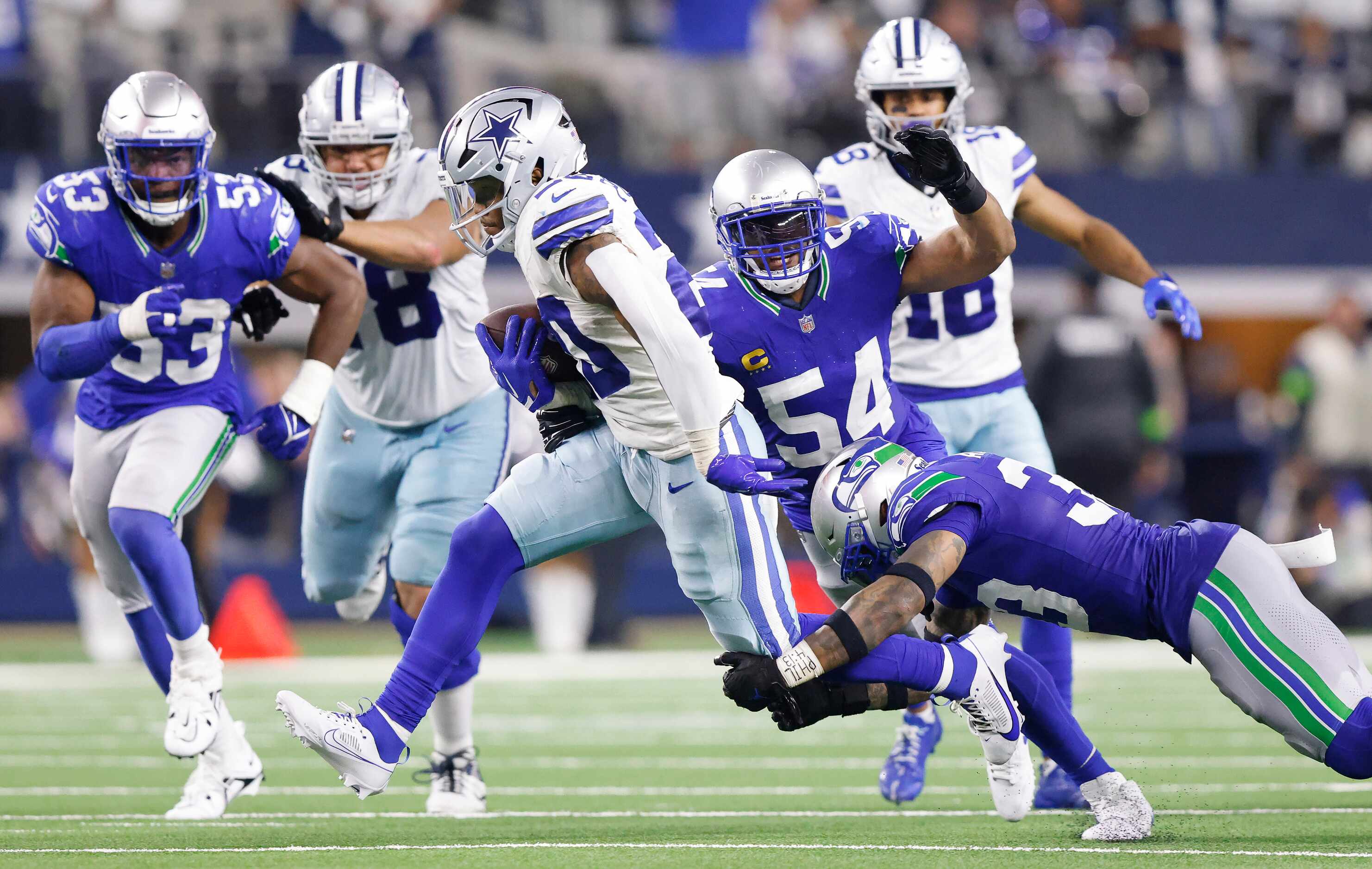 Dallas Cowboys running back Tony Pollard (20) carries the ball during the fourth quarter as...