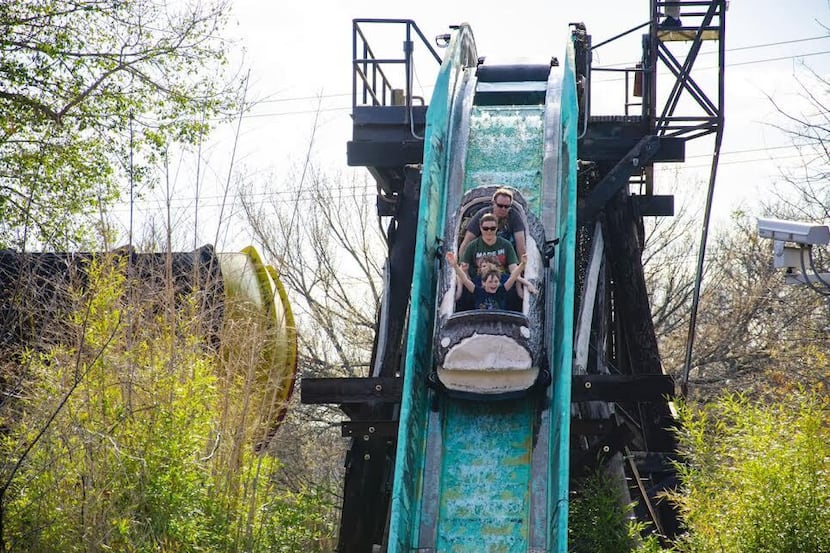 Riders on the El Aserradero log flume at Six Flags Over Texas.